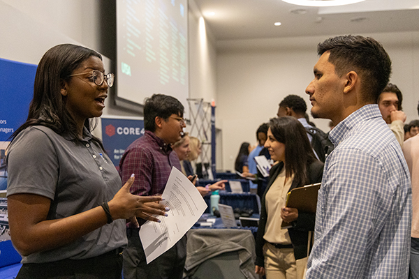 Student speaking to a company hiring rep